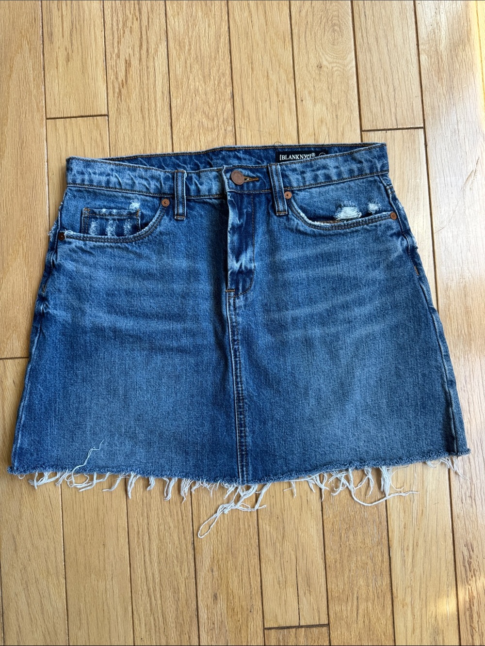 Blank NYC Distressed Blue Denim Mini Skirt with Raw Hem